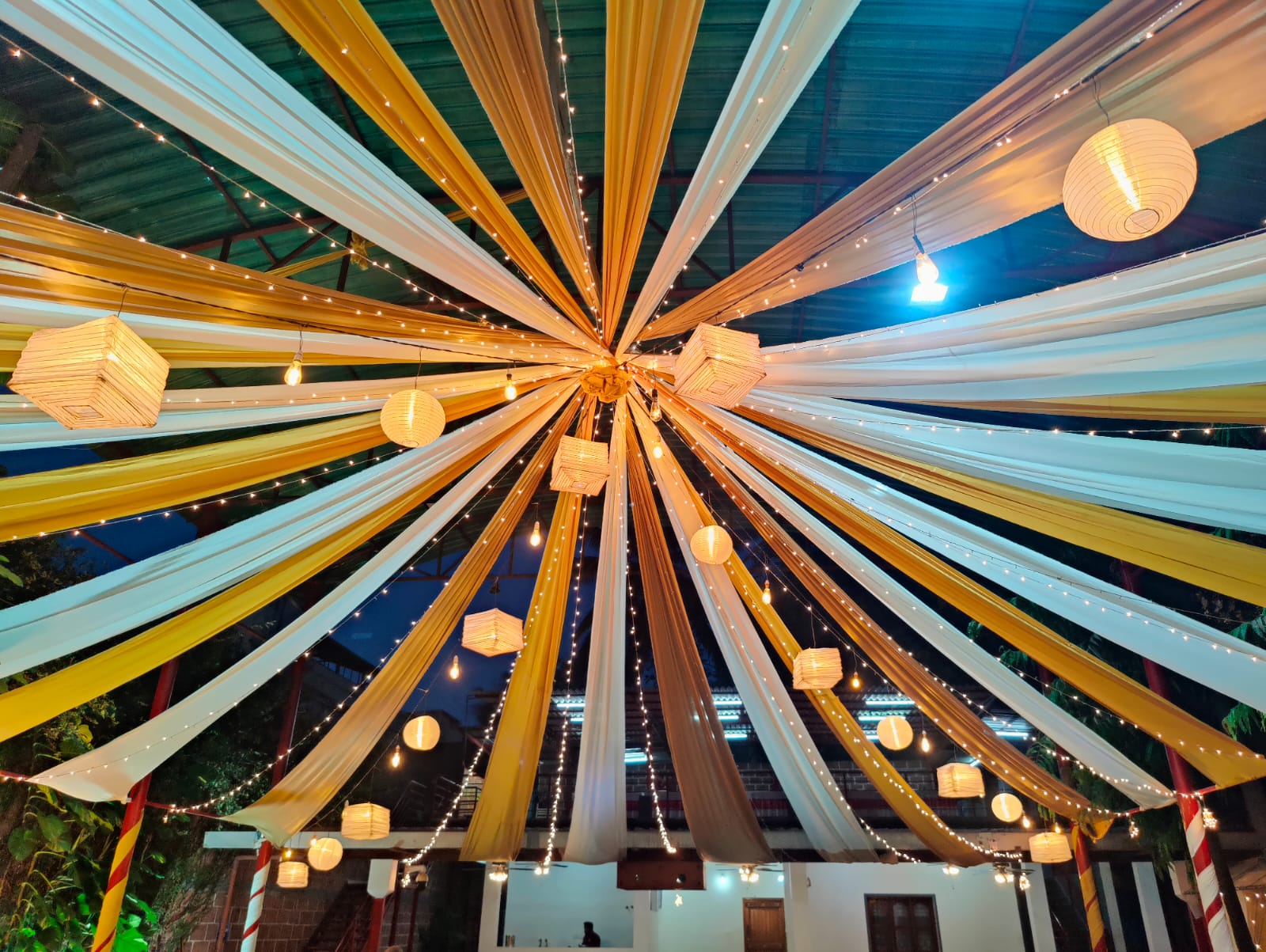 Aerial view of Pergola lawn wedding setup at golden hour.