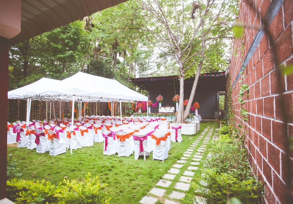 Aerial view of Pergola lawn wedding setup with floral aisle and mandap.